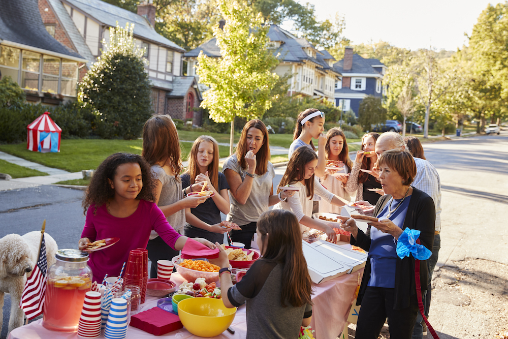 Neighbors helping themselves to food at a block party